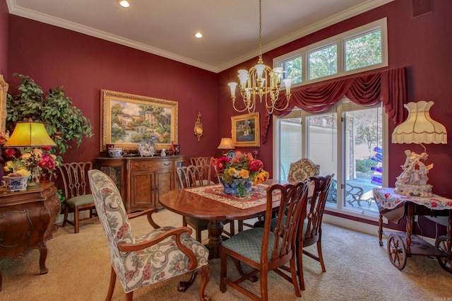 dining area featuring a chandelier, light colored carpet, and crown molding