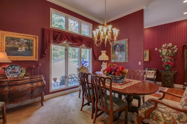 carpeted dining room with crown molding and a notable chandelier