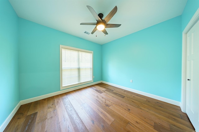 unfurnished bedroom featuring hardwood / wood-style floors and ceiling fan