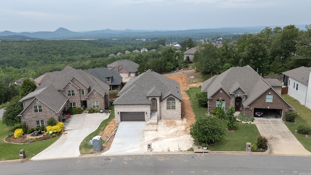 birds eye view of property with a mountain view