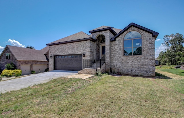 view of front of home featuring a garage and a front lawn