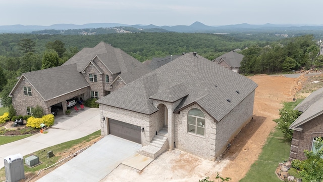 drone / aerial view featuring a mountain view