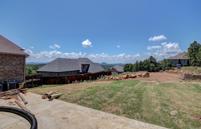 view of yard with a mountain view and a patio area