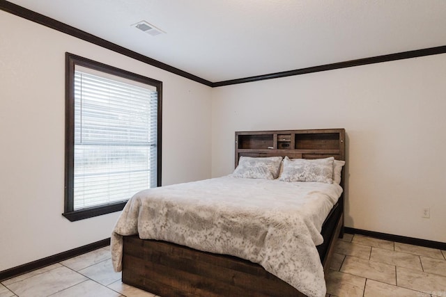 bedroom with light tile patterned floors and ornamental molding