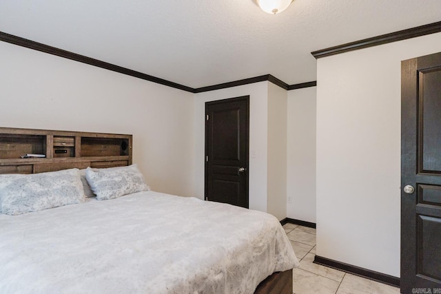 tiled bedroom with a textured ceiling and ornamental molding