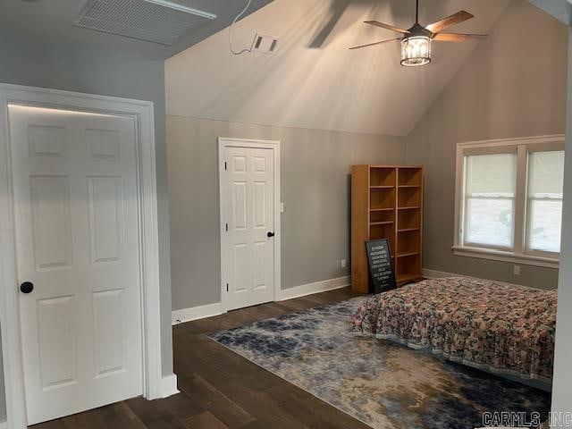 bedroom with vaulted ceiling, ceiling fan, and dark hardwood / wood-style floors