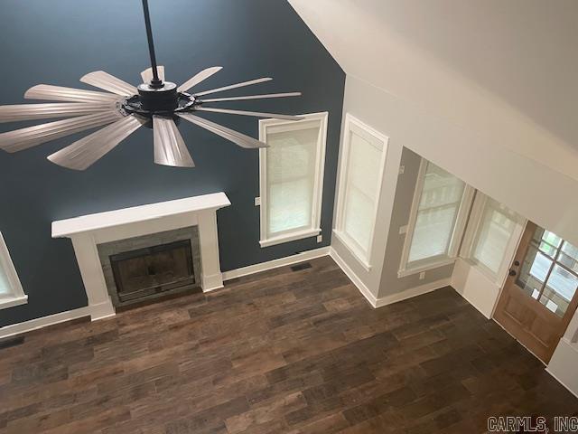 unfurnished living room featuring dark hardwood / wood-style flooring