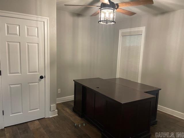 office space with dark wood-type flooring and ceiling fan