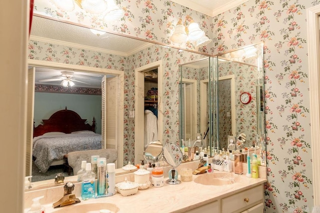 bathroom with vanity, crown molding, and ceiling fan