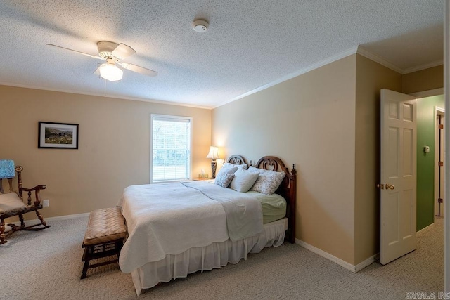 carpeted bedroom featuring ceiling fan, crown molding, and a textured ceiling