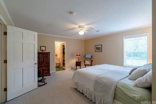 carpeted bedroom featuring ensuite bath, ceiling fan, crown molding, and a textured ceiling