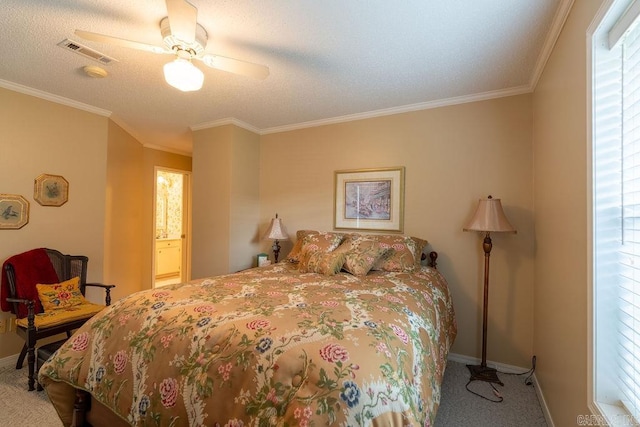 carpeted bedroom with ceiling fan, ornamental molding, a textured ceiling, and ensuite bath