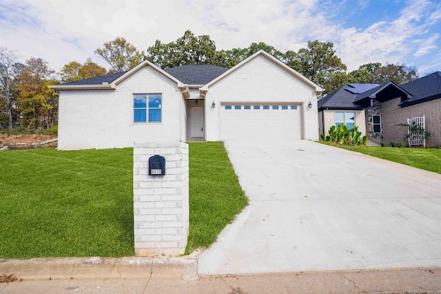 ranch-style house with a garage and a front yard