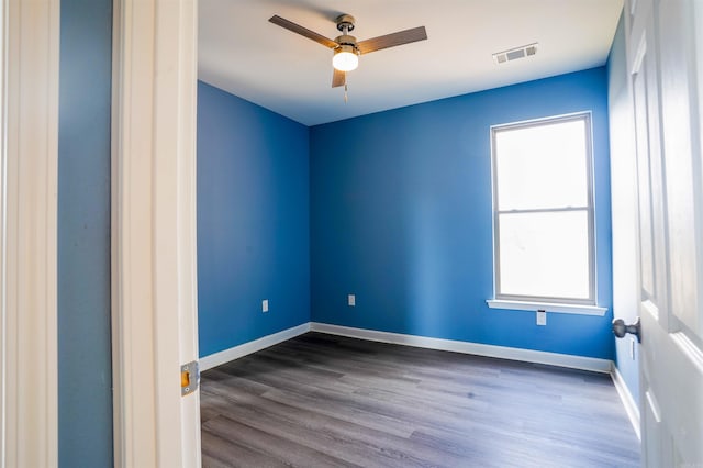 unfurnished room with wood-type flooring and ceiling fan