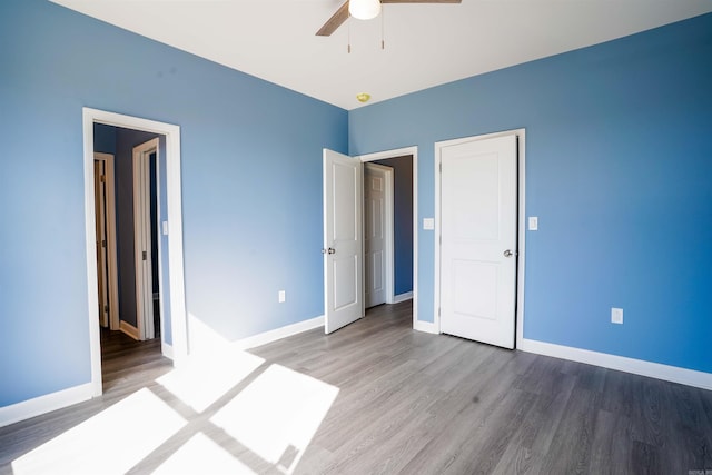 unfurnished bedroom featuring ceiling fan and wood-type flooring