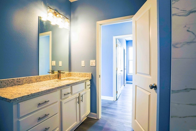 bathroom featuring wood-type flooring and vanity