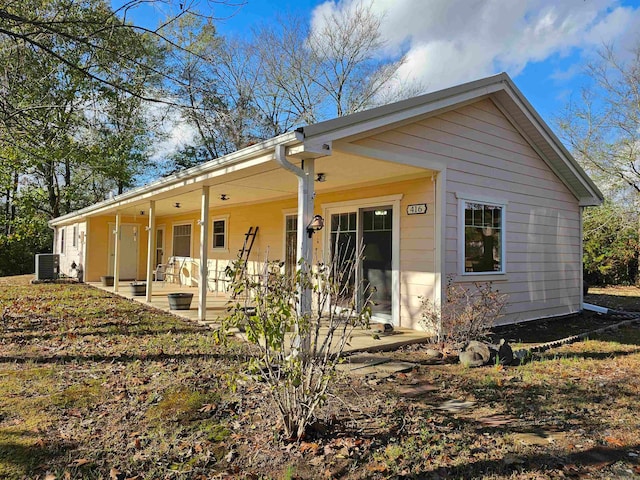 back of house featuring covered porch