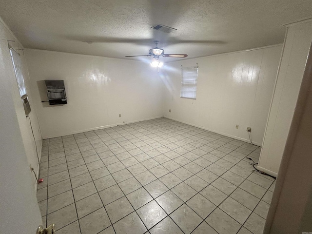 3202 Kendyl, Pine Bluff, AR 71603 - spare room featuring a textured ceiling, ceiling fan, and light tile patterned floors