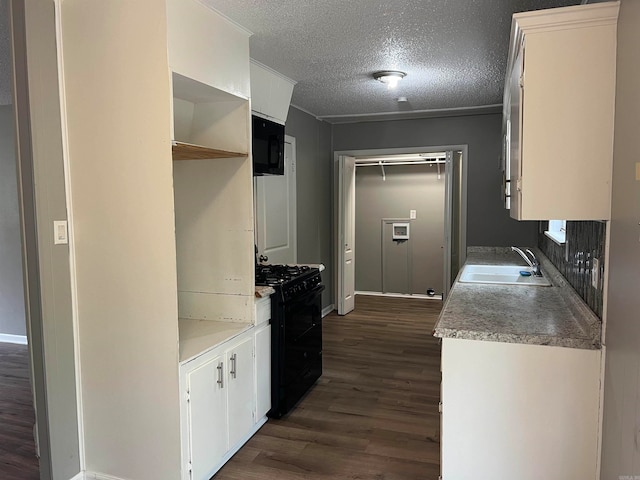 kitchen featuring black appliances, white cabinetry, a textured ceiling, dark hardwood / wood-style flooring, and sink