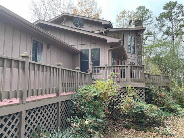 rear view of house featuring a deck