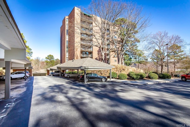 view of property featuring covered parking