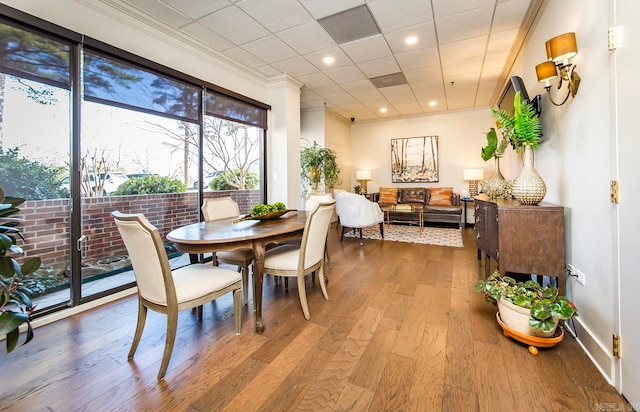 dining area featuring recessed lighting, wood finished floors, and crown molding