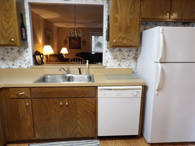 kitchen with sink and white appliances