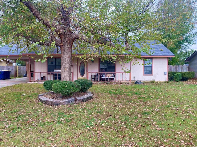 single story home featuring a front lawn and a porch