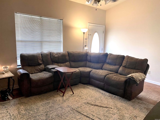 living room with parquet floors and ceiling fan