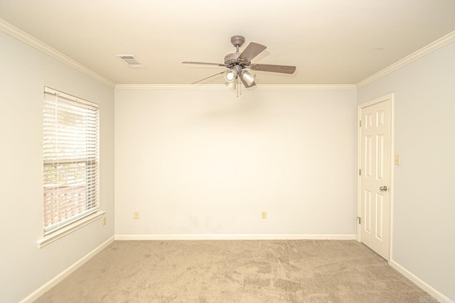 carpeted empty room featuring ornamental molding and ceiling fan