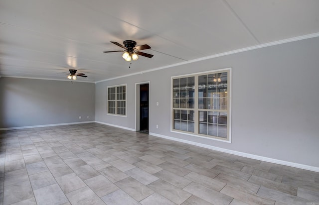 spare room with ceiling fan and crown molding