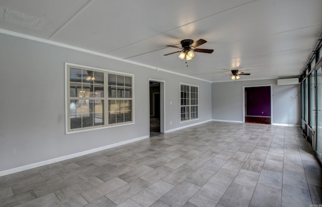 unfurnished sunroom with ceiling fan and a wall mounted air conditioner