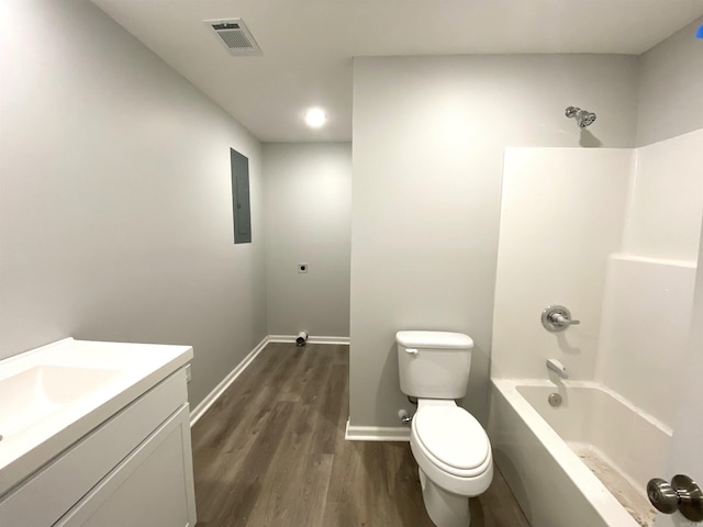 full bathroom with hardwood / wood-style floors, vanity, toilet, and bathtub / shower combination