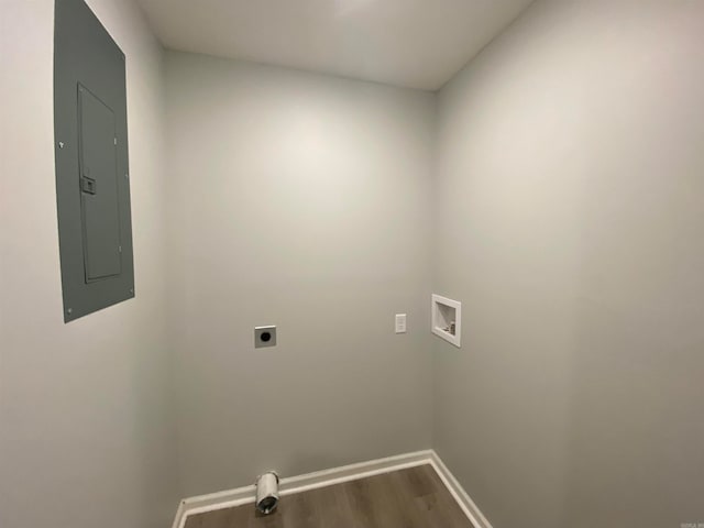 laundry room with electric panel, hookup for a washing machine, electric dryer hookup, and hardwood / wood-style flooring