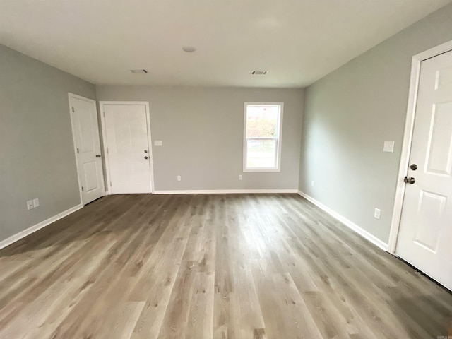 spare room featuring hardwood / wood-style flooring