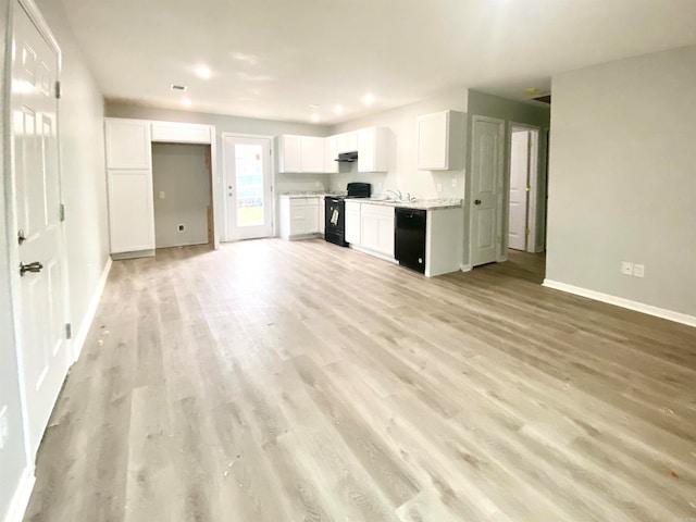 kitchen featuring light hardwood / wood-style floors, sink, black appliances, light stone countertops, and white cabinets