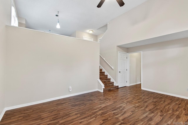 26 Summerwood Cv, Benton, AR 72015 - empty room with a ceiling fan, wood finished floors, baseboards, and a high ceiling