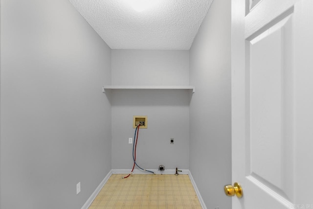 26 Summerwood Cv, Benton, AR 72015 - laundry area with light flooring, washer hookup, a textured ceiling, hookup for an electric dryer, and baseboards