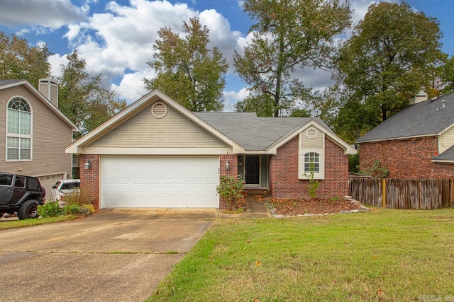 view of front of property with a garage and a front lawn