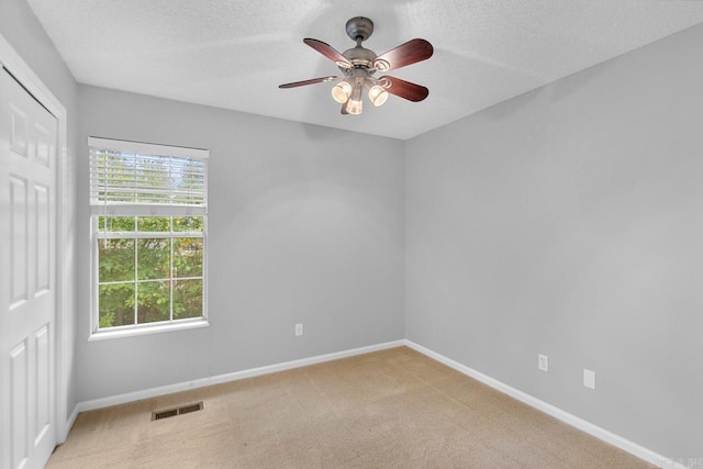 26 Summerwood Cv, Benton, AR 72015 - spare room with a ceiling fan, baseboards, carpet floors, and a textured ceiling