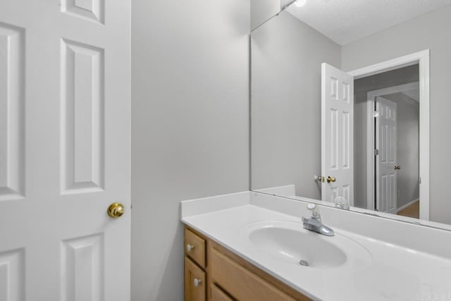 26 Summerwood Cv, Benton, AR 72015 - bathroom with vanity and a textured ceiling