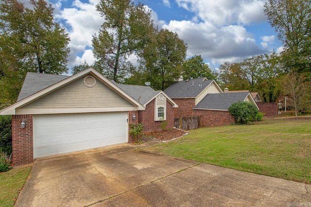 single story home featuring a front lawn and a garage