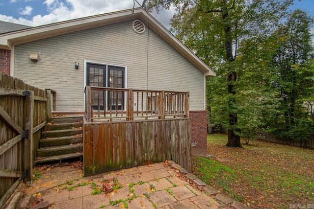 back of property with a wooden deck