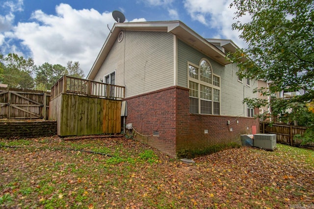 view of side of home featuring central air condition unit