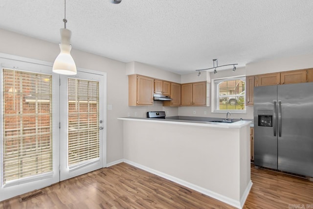 26 Summerwood Cv, Benton, AR 72015 - kitchen with stainless steel appliances, under cabinet range hood, a textured ceiling, wood finished floors, and a sink