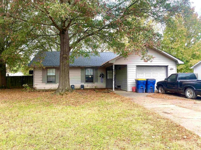 ranch-style house with a garage and a front yard