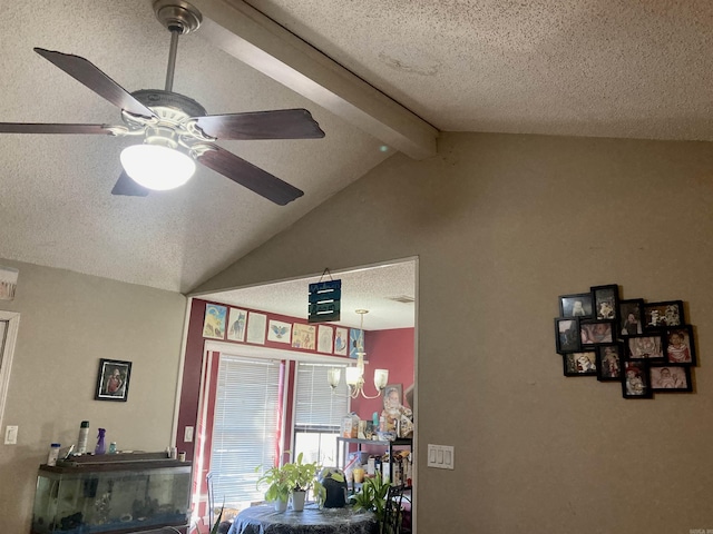 interior details with beamed ceiling, ceiling fan with notable chandelier, and a textured ceiling