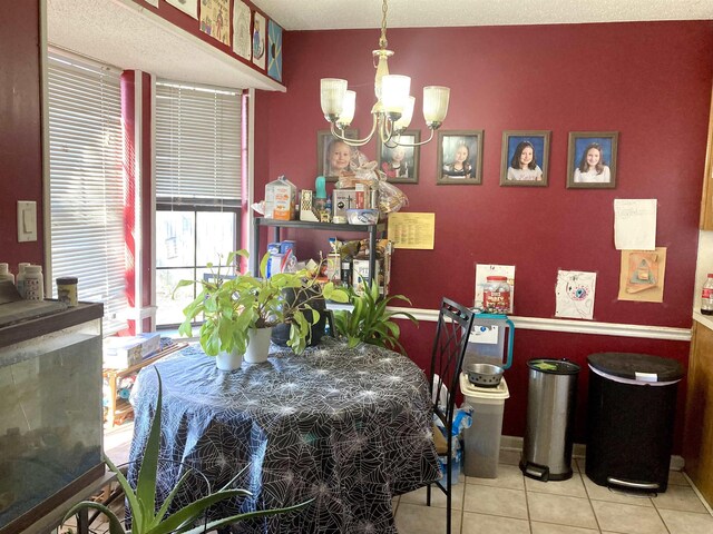 tiled dining area with an inviting chandelier