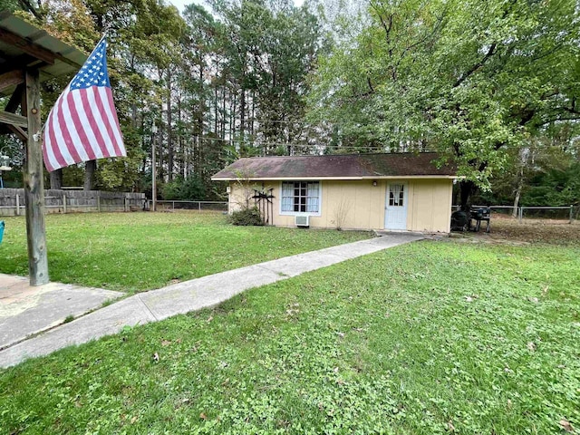 view of front of house with view of wooded area