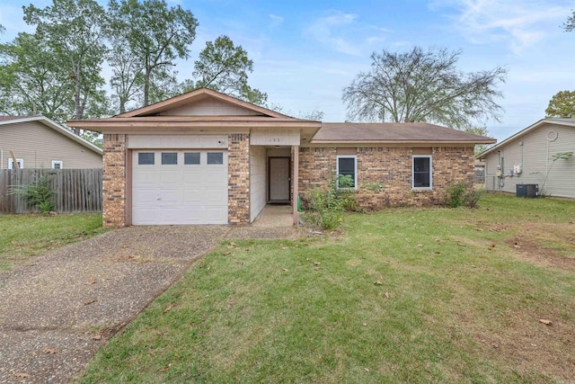 single story home with a front lawn, central air condition unit, and a garage